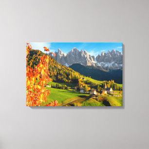 Autumn in a Dolomites landscape with church Canvas Print