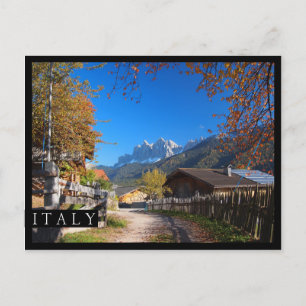 Autumn in a village in the Dolomites in Italy Postcard