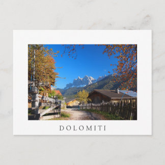 Autumn in a village in the Dolomites in Italy Postcard