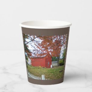 Autumn leaves and a sweet red barn on a mug. coffe paper cups