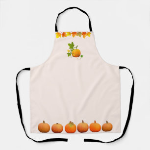 Autumn leaves and pumpkins on light beige apron