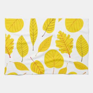 Autumn leaves in yellow kitchen towel
