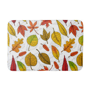 Autumn leaves on white bath mat