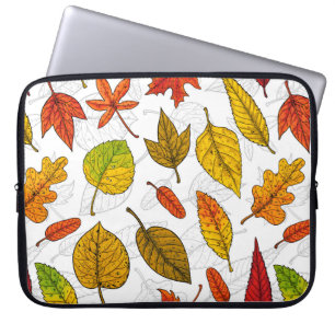Autumn leaves on white laptop sleeve