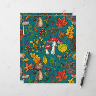 Autumn mushrooms, leaves, nuts and berries on blue