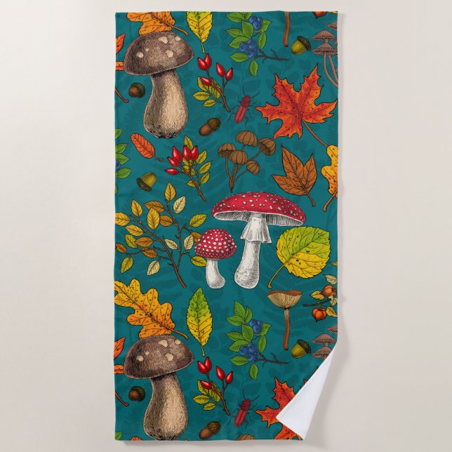 Autumn mushrooms, leaves, nuts and berries on blue beach towel (Front)