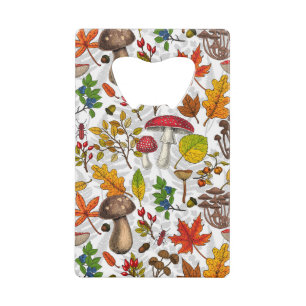 Autumn mushrooms, leaves, nuts and berries on blue credit card bottle opener