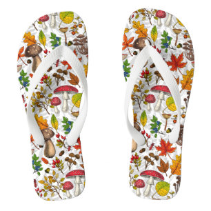 Autumn mushrooms, leaves, nuts and berries on blue flip flops