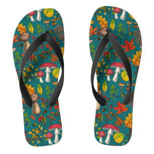 Autumn mushrooms, leaves, nuts and berries on blue flip flops