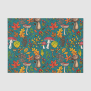 Autumn mushrooms, leaves, nuts and berries on blue tissue paper