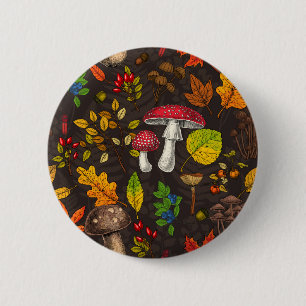 Autumn mushrooms, leaves, nuts and berries on dark 2 inch round button