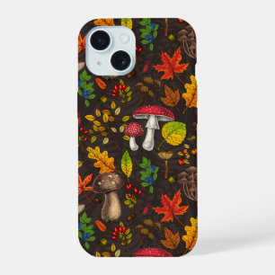 Autumn mushrooms, leaves, nuts and berries on dark iPhone 15 case