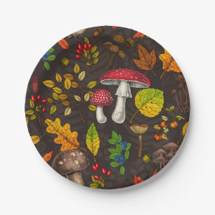 Autumn mushrooms, leaves, nuts and berries on dark paper plate