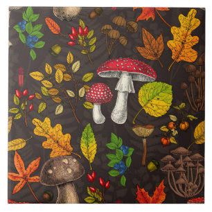 Autumn mushrooms, leaves, nuts and berries on dark tile