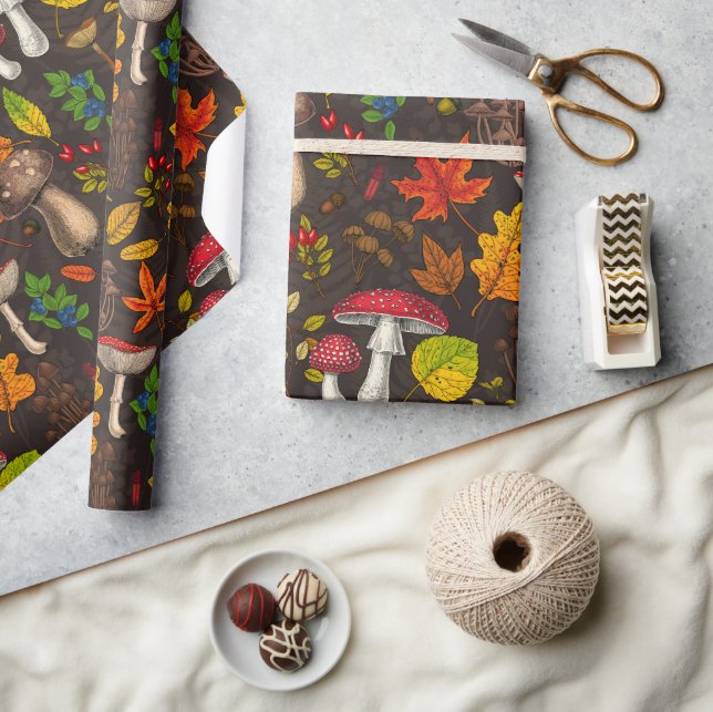 Autumn mushrooms, leaves, nuts and berries on dark wrapping paper (Crafts)