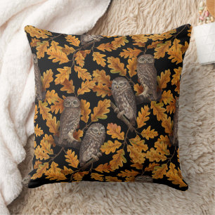 Autumn owls on black throw pillow