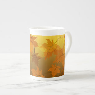 Autumn pattern with falling maple leaves and bokeh bone china mug