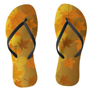Autumn pattern with falling maple leaves and bokeh flip flops