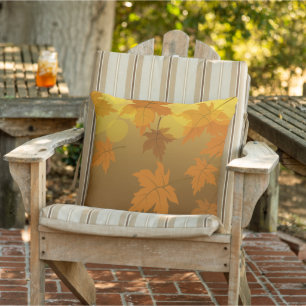 Autumn pattern with falling maple leaves and bokeh outdoor pillow