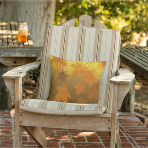 Autumn pattern with falling maple leaves and bokeh outdoor pillow