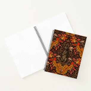 Autumn rabbit on brown notebook