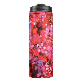 Autumn red violet vibrant bush foliage background thermal tumbler