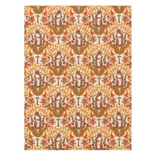 Autumn squirrel on off white tablecloth