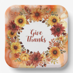 Autumn themed thanksgiving with flowers pumpkins paper plate