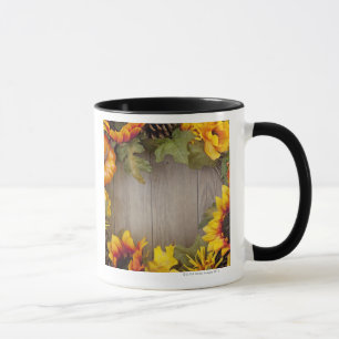 Autumn wreath on wood background mug
