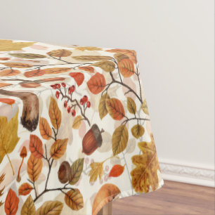 Autumnal forest on off white tablecloth