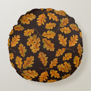 Autumnal oak leaves on dark brown round pillow