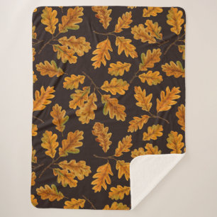 Autumnal oak leaves on dark brown sherpa blanket