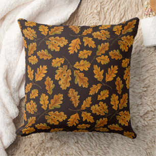Autumnal oak leaves on dark brown throw pillow