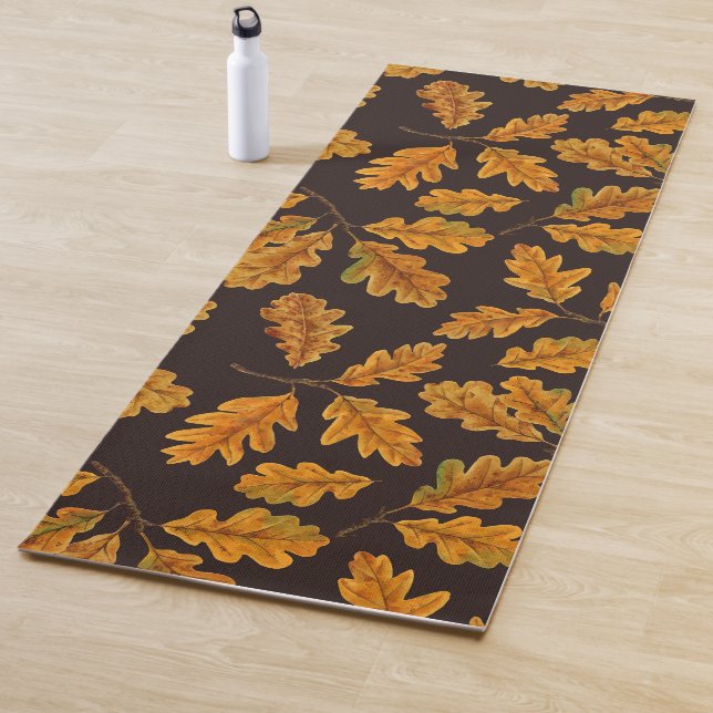 Autumnal oak leaves on dark brown yoga mat (In Situ)