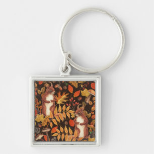 Autumnal squirrels and flora on dark brown keychain