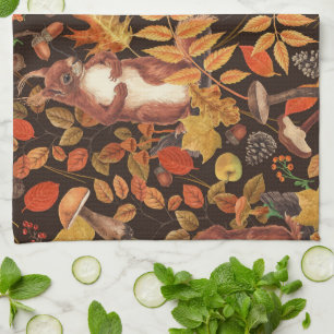 Autumnal squirrels and flora on dark brown kitchen towel