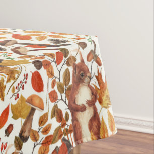 Autumnal squirrels and flora on dark brown tablecloth
