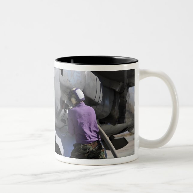 Aviation fuel technician attaches a fuel line Two-Tone coffee mug (Right)