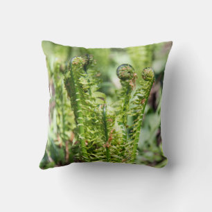 Awakening young fern in the garden throw pillow