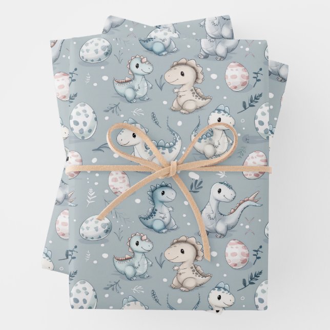 Baby dinosaurs on blue wrapping paper sheet (In situ)