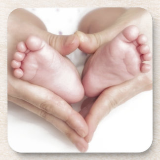 Baby feet in mother hands coaster