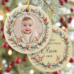 Baby First Christmas Photo Woodland Gold Ceramic Ornament<br><div class="desc">Commemorate your little one’s first Christmas with this elegant woodland-inspired ceramic ornament featuring a custom photo framed in soft greenery and gold accents. The design blends rustic forest charm with a touch of holiday shimmer, creating a keepsake you’ll treasure for years. Perfect as a thoughtful gift for new parents or...</div>