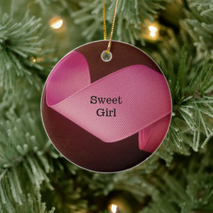 Baby girl first Christmas pink ribbon twirling Ceramic Ornament