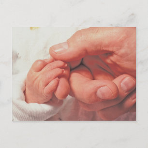 baby in dad hands postcard