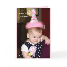 Baby looking grumpy at her first birthday party