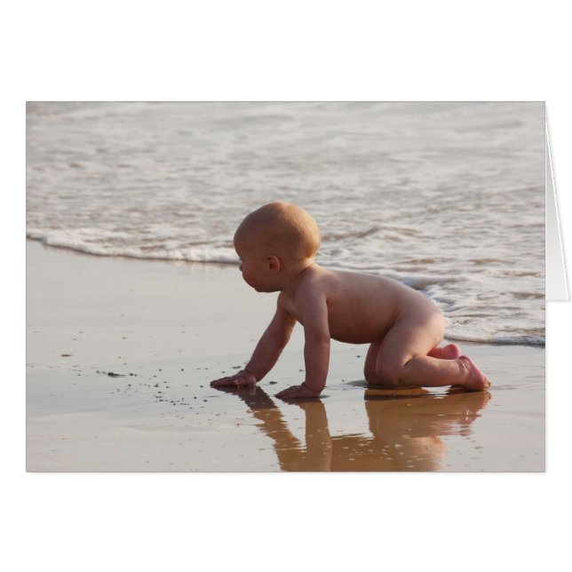 Baby playing in the sand on the beach (Front Horizontal)