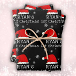Baby`s First Christmas Black Santa Hat Snowflake  Wrapping Paper Sheet<br><div class="desc">Baby`s First Christmas Black Red Santa Hat Snowflake Wrapping Paper Sheets. Cute baby first Christmas design with a Santa hat,  snowflakes and a baby name in a white script - personalize with your baby`s name.</div>