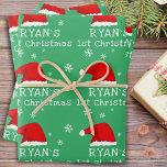 Baby`s First Christmas Green Santa Hat Snowflake Wrapping Paper Sheet<br><div class="desc">Baby`s First Christmas Green Red Santa Hat Snowflake Wrapping Paper Sheets. Cute baby first Christmas design with a Santa hat,  snowflakes and a baby name in a white script - personalize with your baby`s name.</div>