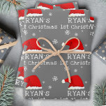 Baby`s First Christmas Grey Santa Hat Snowflake Wrapping Paper Sheet<br><div class="desc">Baby`s First Christmas Grey Red Santa Hat Snowflake Wrapping Paper Sheets. Cute baby first Christmas design with a Santa hat,  snowflakes and a baby name in a white script - personalize with your baby`s name.</div>