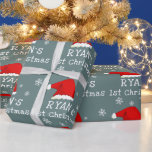 Baby`s First Christmas Red Santa Hat Snowflake Wrapping Paper<br><div class="desc">Baby`s First Christmas Red Santa Hat Snowflake Wrapping Paper. Cute baby first Christmas design with a Santa hat,  snowflakes and a baby name in a white script - personalize with your baby`s name.</div>